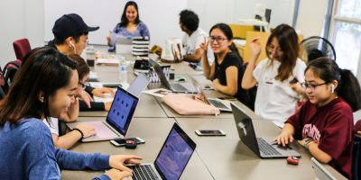 Students around a conference table