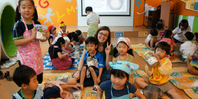 Teacher surrounded by children